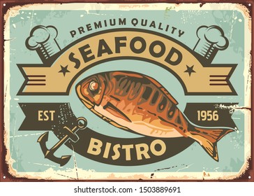 Premium quality seafood restaurant vintage tin sign with grilled fish and emblem design. Retro poster for bistro on old rusty metal background. Vector illustration.