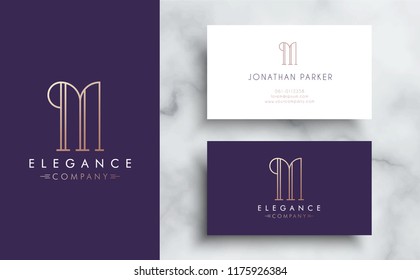 Premium vector letter M logo with business card tamplate. Luxury brand identity for your company. Elegant corporate design on marble background .