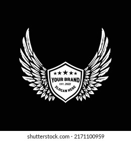 Premium white wings badge shield emblem logo design vector isolated on black background