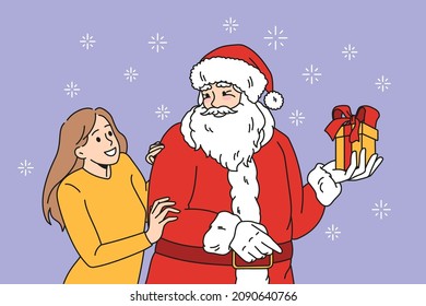 Preparation for Christmas holidays concept. Positive young woman standing and hugging Santa holding present present in box with ribbon vector illustration 