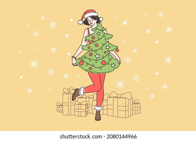 Preparation for Christmas and New Year holidays concept. Smiling happy girl standing and wearing Christmas tree with decorations as dress and Santa hat over holiday presents vector illustration 