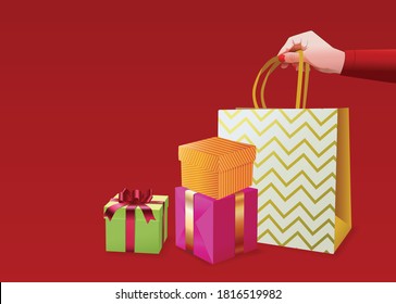 Preparation, ordering and delivery of New Year and Christmas decorated gifts online via the Internet 2021. Hand holds a package near decorated boxes on a red background. Vector poster for the holiday.
