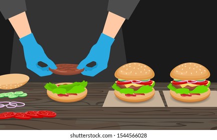 prepare burger process. chef hands in gloves put meat cutlet on lettuce bun