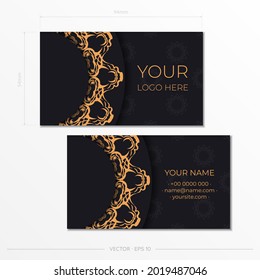 Preparing business cards in black with luxurious gold patterns. Template for print design business card with vintage ornament.