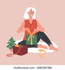 Preparing for the new year, christmas. The girl is packing a gift.