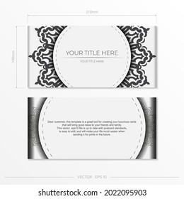 Preparing postcards in white with black patterns.