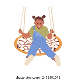 Preschool girl cartoon character on round rope swing having fun time on kindergarten playground