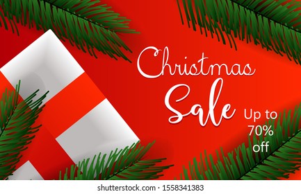 Present boxes on Christmas tree leaves decorative background