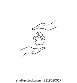 Present, charity, giving concept. Outline monochrome symbols drawn in flat style. Suitable for articles, advertisements, books etc. Line icon of dogs paw between outstretched hands