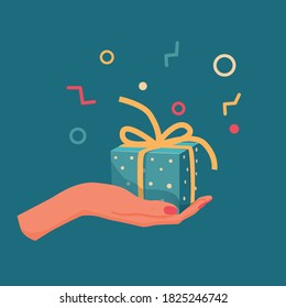 Present in a female hand with scattered sweets.Presenting a gift on a blue background.Gift wrap with a yellow ribbon tied in a bow.Use it as a symbol of a holiday, discount or surprise.Vector icon