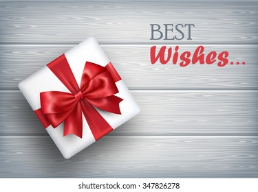 Present Gift Box with Bow on Wooden Background