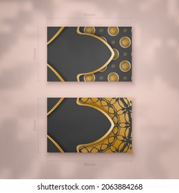 Presentable business card in black with a mandala in gold ornaments for your brand.