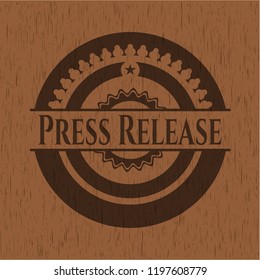 Press Release badge with wood background