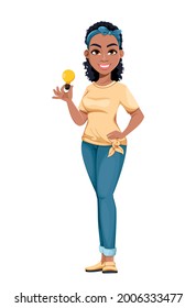 Pretty African American housewife holding lamp