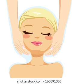 Pretty blonde woman enjoying facial massage beauty therapy