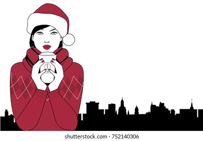 Pretty brunette girl wearing a santa claus hat drinking a hot drink at Christmas. City sky line in the background