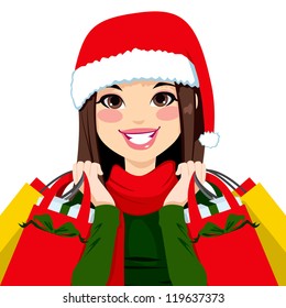 Pretty brunette woman happy carrying Christmas shopping bags with big smile