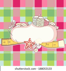 Pretty card with sewing accesories surrounding a blank white cartouche 