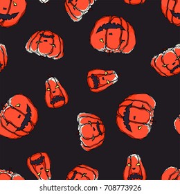 Pretty colorful seamless halloween pattern made of hand drawn orange pumpkins.