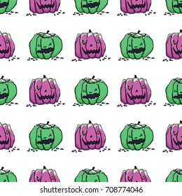 Pretty colorful seamless halloween pattern made of hand drawn green and violet pumpkins.