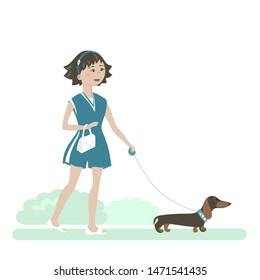 Pretty fashion girl on a walk with a dog. 