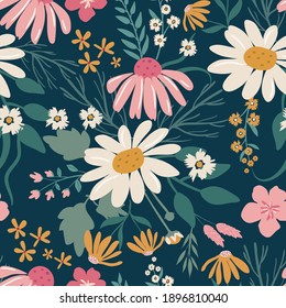 Pretty floral pattern in big and small flowers and leaves. Hand drawn flower motifs in navy background.