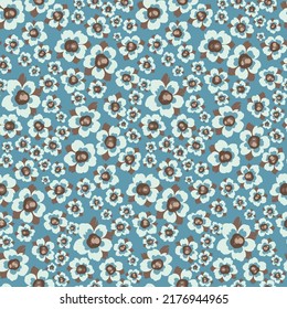 Pretty hand drawn floral pattern in retro style. Cute ditsy print, seamless pattern with decorative flowers on a blue field. Beautiful botanical background with small plants, flowers, leaves. Vector.