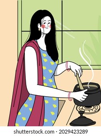 Pretty Indian Woman Is Cooking In The Kitchen