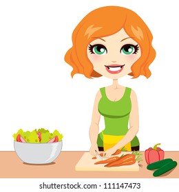 Pretty red haired woman preparing healthy nutritious salad cutting vegetables