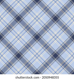 Pretty tones of blue diagonal plaid. Seamless vector tartan pattern suitable for fashion, home decor and stationary.