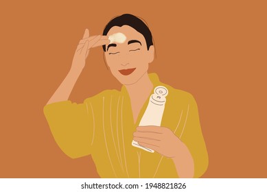 Pretty woman apply cream or scrub on face in yellow bathrobe while holding a tube. Clean and beauty skincare. Vector Illustration.