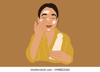 Pretty woman apply cream or scrub on face in yellow bathrobe while holding a tube. Clean and beauty skincare routine. Vector Illustration.