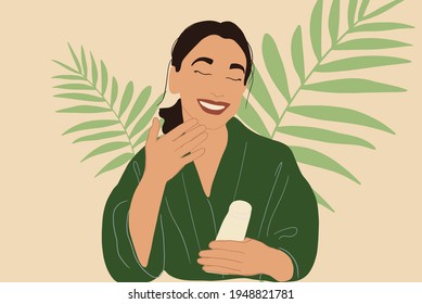 Pretty woman apply gel or serum on face in green bathrobe while holding a tube with palm leafs on behind. Clean and beauty skincare routine. Anti-aging. Vector Illustration.