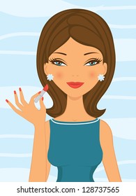 Pretty woman applying lipstick on her lips