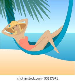 Pretty woman relaxing in hammock on the beach