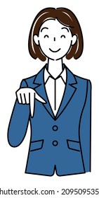 A pretty woman in a suit, smiling and pointing downward with her finger. Business person illustration vector