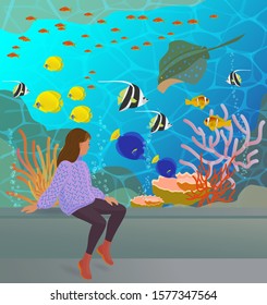 The pretty young girl sits near the big aquarium and looks at the colorful underwater world with fishes, corals and ramp. Vector illustration with texture in cartoon style.