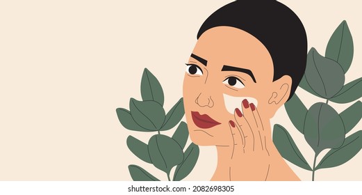 	
Pretty young woman applying face cream. Skincare procedure, routine day illustration. Application of cosmetic product vector. Tropical leaves,  green plant on background. Skin care  advertisement.  