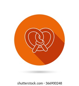 Pretzel icon. Bakery food sign. Traditional bavaria snack symbol. Round orange web button with shadow.