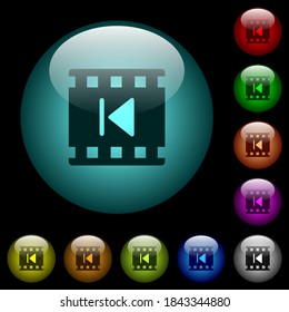 Previous movie icons in color illuminated spherical glass buttons on black background. Can be used to black or dark templates