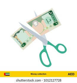 Price or cost reduction concept. Scissors cutting money bill. Dirham banknote.