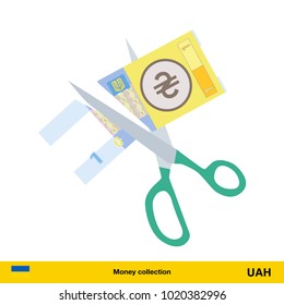 Price or cost reduction concept. Scissors cutting money bill.  hryvnia banknote.