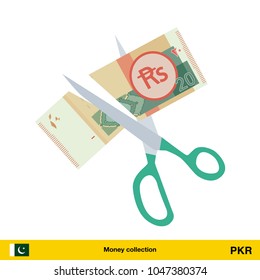 Price or cost reduction concept. Scissors cutting money bill. Pakistan rupee banknote.

