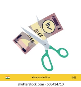 Price or cost reduction concept. Scissors cutting money bill. Indian rupee banknote.