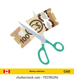 Price or cost reduction concept. Scissors cutting money bill. Canadian dollar banknote.