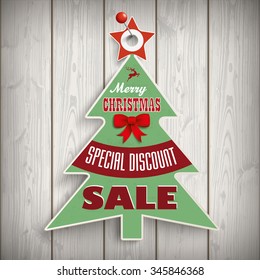 Price sticker for the christmas sale on the wooden background. Eps 10 vector file.