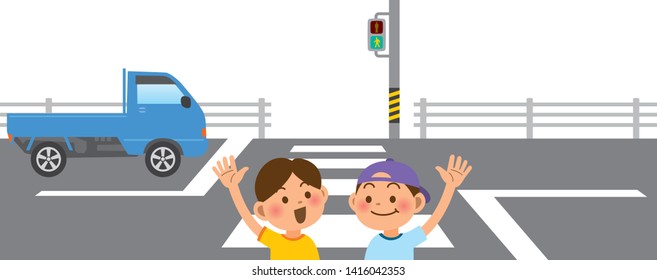 Primary school students crossing the pedestrian crossing with their hands raised