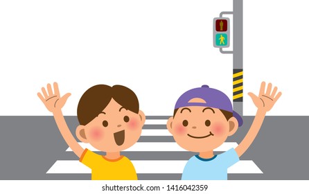 Primary school students crossing the pedestrian crossing with their hands raised