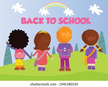 Primary school students standing at the park while looking at the back to school text and rainbow on the sky