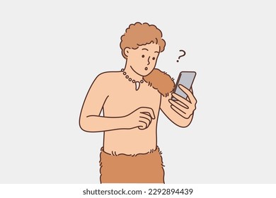 Primitive man with phone is surprised to see modern technology for first time and is shocked by video or music from internet. Primitive man with animal skin on belt holds mobile phone for first time 